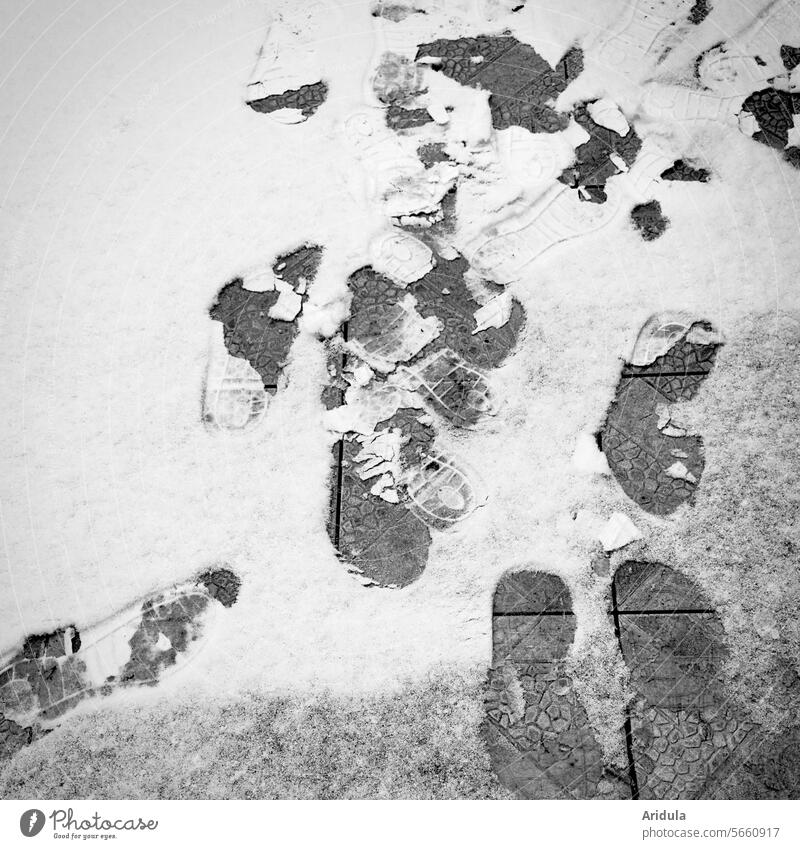 Tracks on the snow-covered terrace b/w Snow Traces of snow Terrace Prints Footwear footprints Winter Cold Exterior shot winter