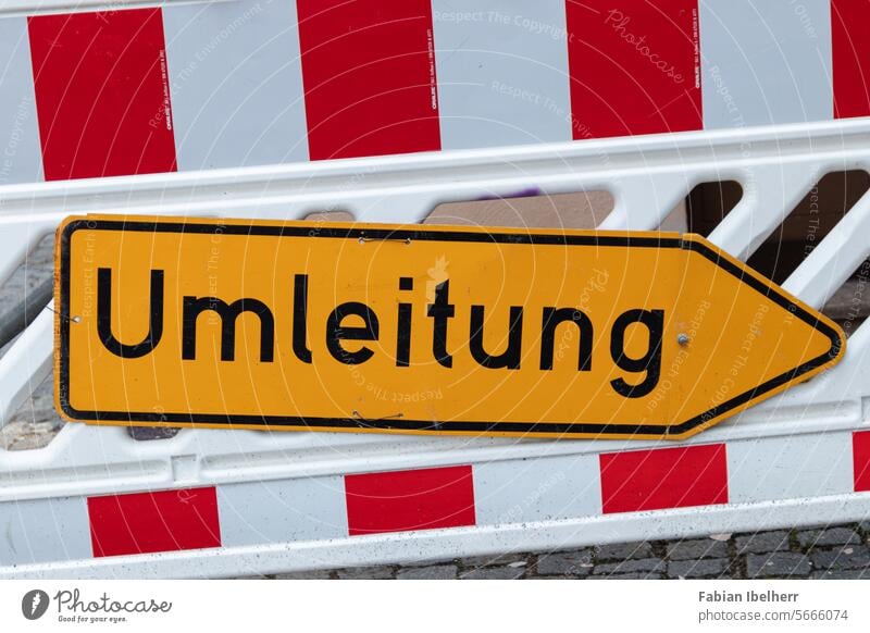 Signpost indicates detour at a roadworks site Diversion Construction site Road sign cordon Signs and labeling construction works