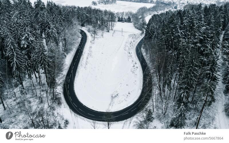 Winter Wonderland Aerial View: Snowy Streets Captured by Drone above adventure aerial photography aerial road aerial view aerial winter asphalt background