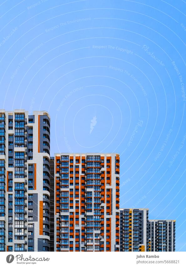 freshly built high rise apartment buildings on blue sky background condo condominium mortgage urbanization russian day clean real photo architecture copy space