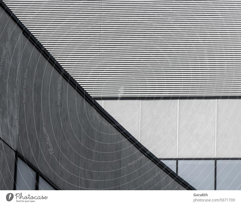 fragment of gray concrete building with a striped wall and empty windows close up Ukraine abstract abstract background angle architecture black blank business