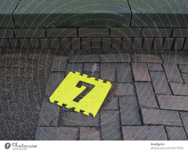 7 Digits and numbers sieving jettisoned Signs and labeling Exterior shot Colour photo Lie Toys Deserted digit Puzzle piece Foam rubber Yellow punched