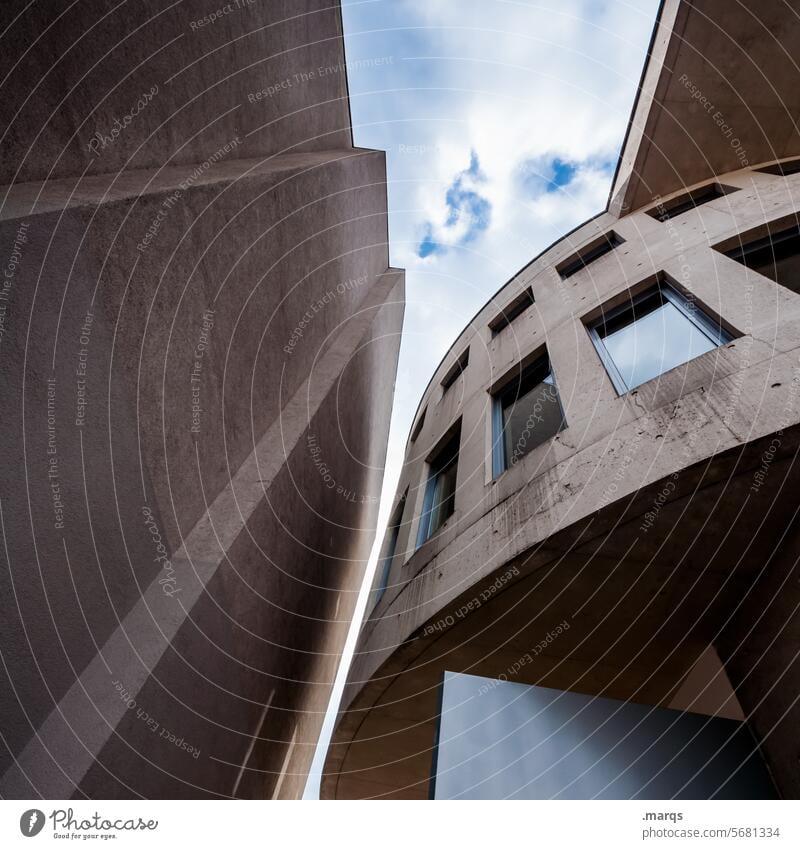 building Architecture Manmade structures Perspective Skyward Worm's-eye view Round Sharp-edged Window mightily Clouds Concrete brutalism