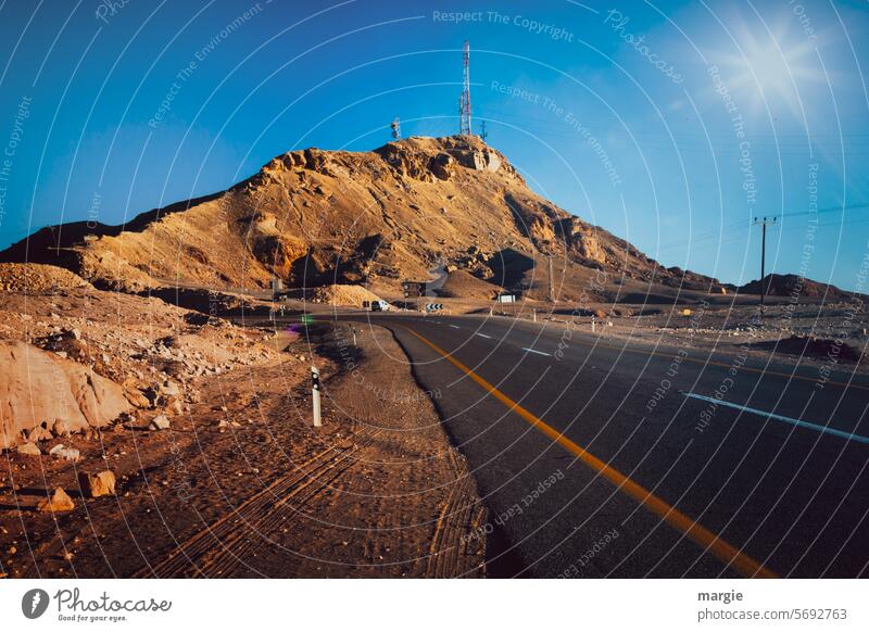 Road through the Negev desert, Israel, transmission tower and power line Desert Street Exterior shot Deserted Landscape Label Broadcasting tower