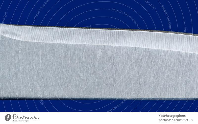 Knife blade close up, isolated on a blue background abstract accesory baking blank bright butcher chef chrome color cook copy space cut cut out details edge