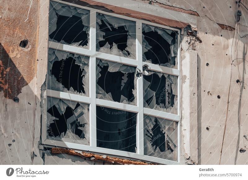 empty windows of a damaged house in Ukraine Donetsk Kherson Kyiv Lugansk Mariupol Russia Zaporozhye abandon abandoned attack bakhmut blown up bombardment broken