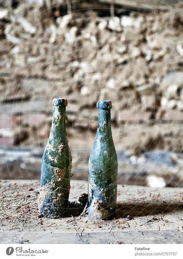 Nobody drinks from these two completely filthy bottles in a lost place. lost places forsake sb./sth. Old Transience Change Ravages of time Dirty Gloomy dirt