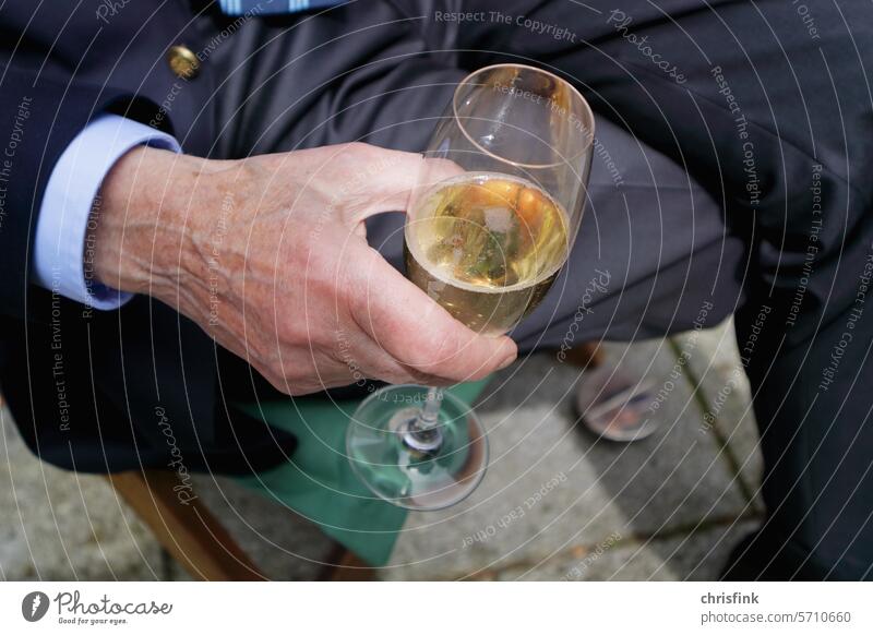 Hand of old man holding champagne glass Man Old age Sparkling wine Glass Champagne glass Addiction Alcoholic drinks alcoholism Alcoholics celebration Firm