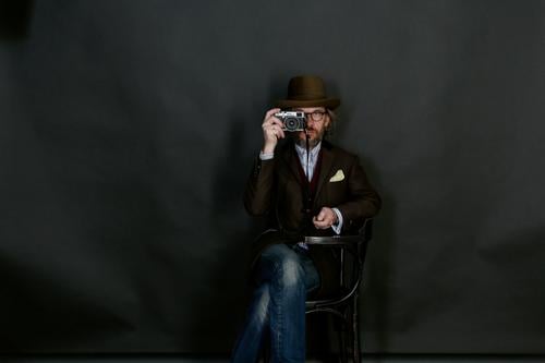 self-portrait Professor Camera Masculine Artist Media Film industry Video Shirt Jeans Suit Eyeglasses Hat Beard Esthetic Gentleman Hüxstrasse Lübeck Berlin