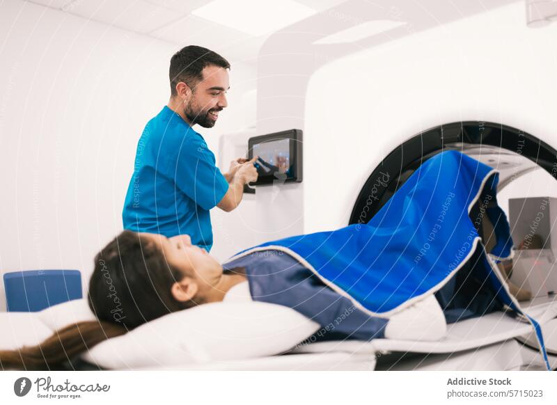 Radiologist preparing patient for a CT scan procedure healthcare medical radiologist ct scan computed tomography hospital technology professional machine