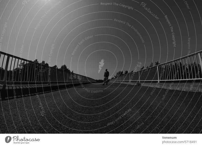 Analog black and white photograph, man standing on a bridge, black and white Analogue photo analogue photography analog photography analog image