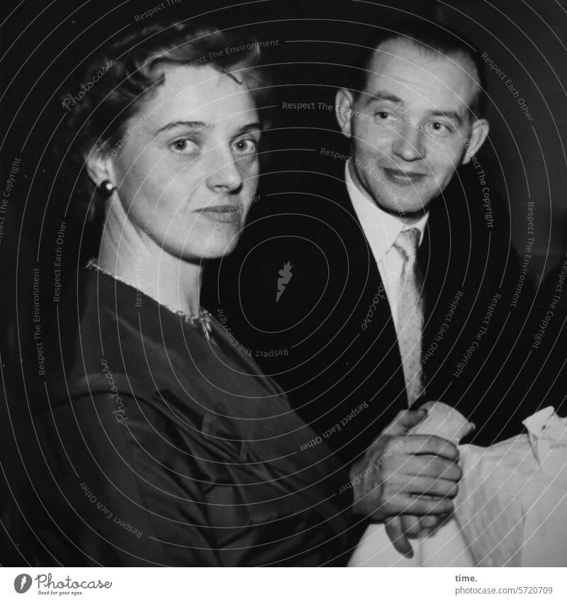 Couple at the table Woman Man celebration Looking into the camera Earnest Smiling portrait then Face