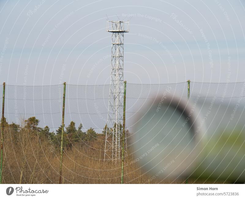 Transmission mast behind a high fence Broadcasting tower Infrastructure radio mast Telecommunications Connection Communications Engineering Technology Antenna