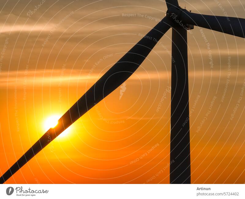 Wind farm field and sunset sky. Wind power. Sustainable, renewable energy. Wind turbines generate electricity. Sustainable development. Green technology for energy sustainability. Eco-friendly energy.