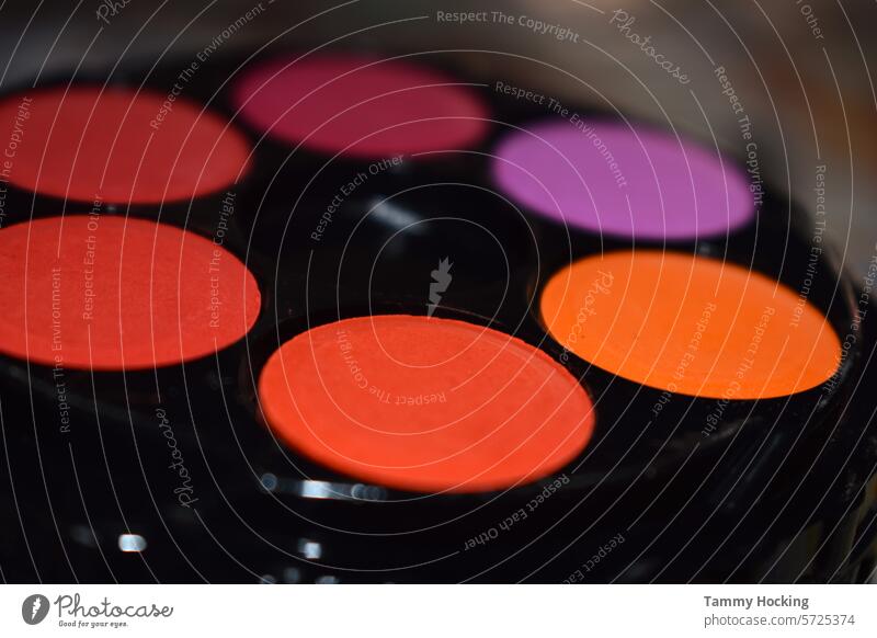 Water colour pallet  in a circle showing a range of colours from orange to purple paint Watercolours Art Multicoloured variegated Artist shape circle shape