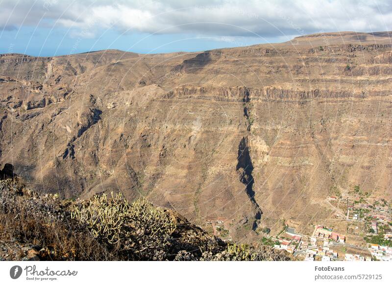 Mountains with a small village in the valley natural park high nature day panorama background trees summer Spain mountain range mountain village island outdoors