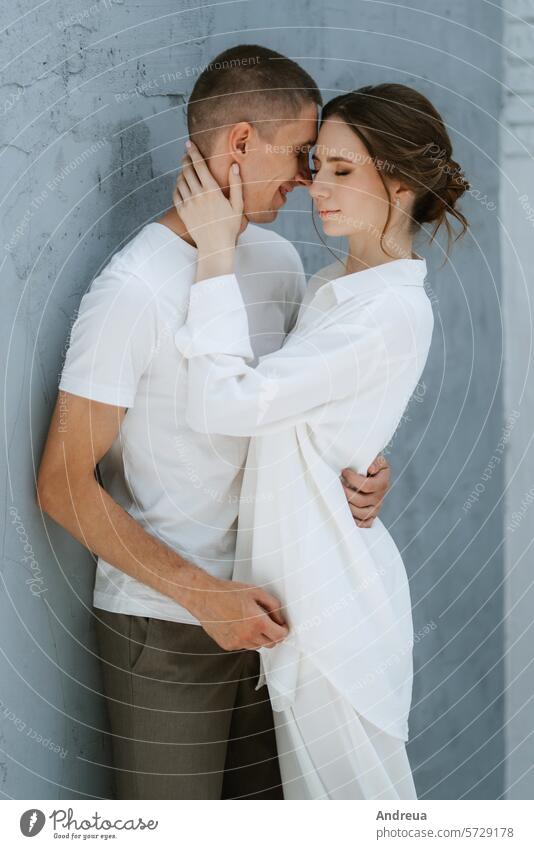 young couple guy and girl in a bright room brick brown corner ears friend gray grey light man's friend nose smooth tail teeth three tile tongue two wall white