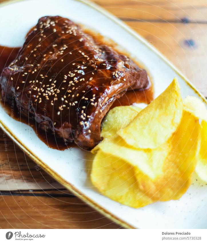 Pork ribs with sweet and sour barbecue sauce steak house ribs bbq rosemary delicatessen glazed tasty delicious food meal top view loin bones close-up summer