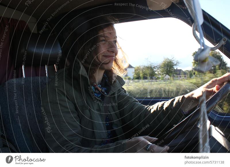 woman at the wheel Woman car Driving tax Steering Vacation & Travel Bus travel Mobility Vehicle Motoring cheerful Smiling van look ahead steer Face Profile