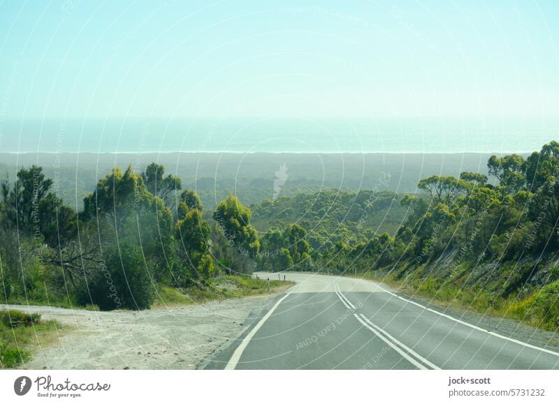 Panorama with a view of the ocean Street Traffic infrastructure Country road Traffic lane empty street Road movie In transit Median strip Lane markings