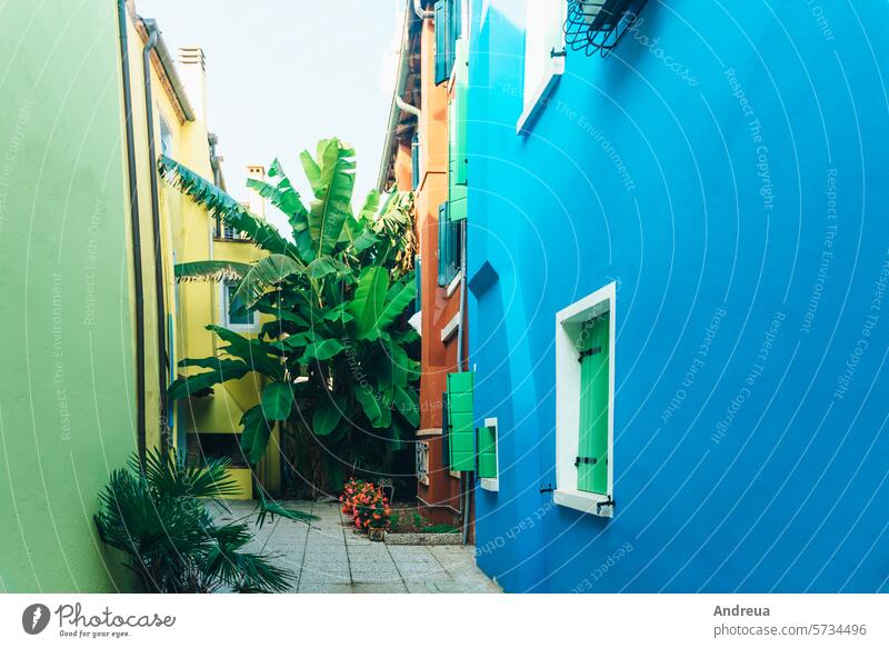 Tourist district of the old provincial town of Caorle in Italy adriatic benches bicycle blue city classic coast colorful fishing green houses leisure narrow