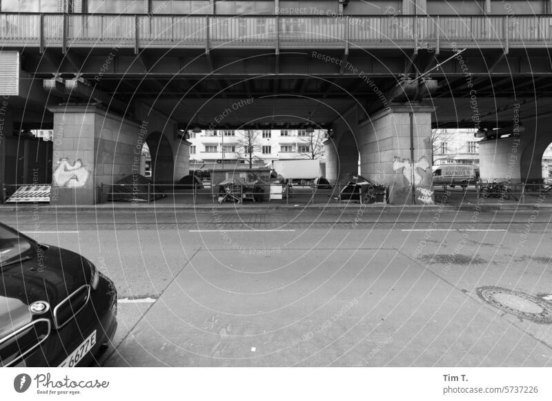 Homeless under the elevated train Berlin Prenzlauer Berg b/w Tramp Black & white photo Town Downtown Capital city bnw Exterior shot Day Old town Deserted