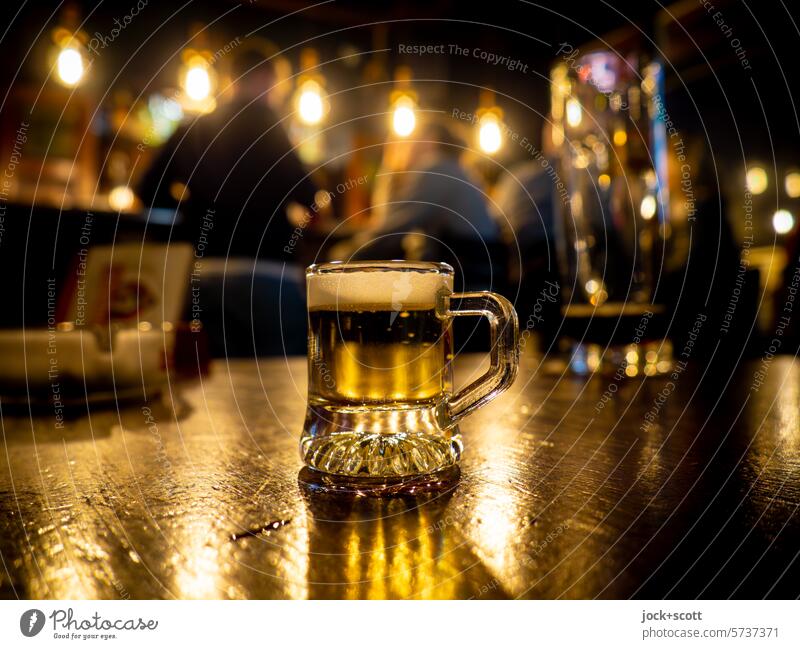 In a Berlin corner pub with a mini beer Beer Gastronomy Beer glass Alcoholic drinks Table Roadhouse blurriness guest room Prenzlauer Berg Night Glass