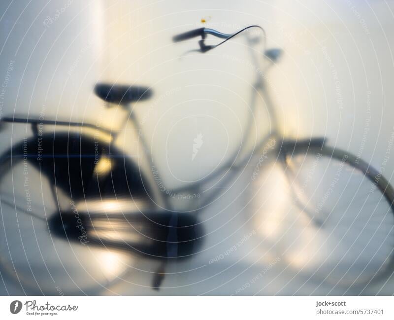 Silhouette of a wire wheel Bicycle Reflection Shop window blurriness Light (Natural Phenomenon) hollandrad New Artificial light Subdued colour Store premises