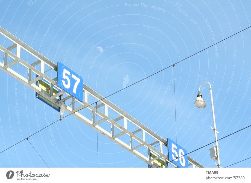 57 with moon + lamp Lamp Overhead line Railroad tracks Street lighting Moon Blue Sky Blue sky