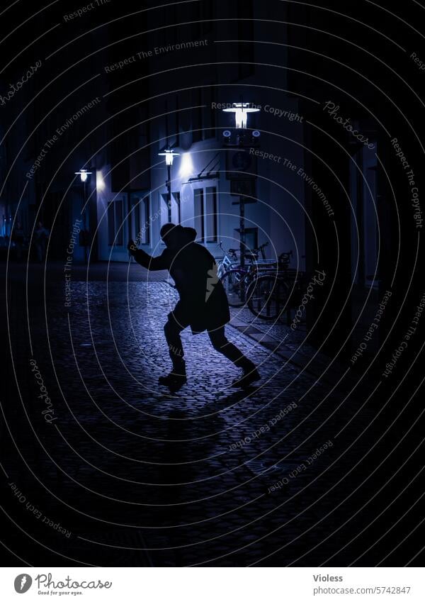 At night in Hildesheim Dark lane cobblestones roguish streetlamp Silhouette Blue criminal Crime scene ghostly