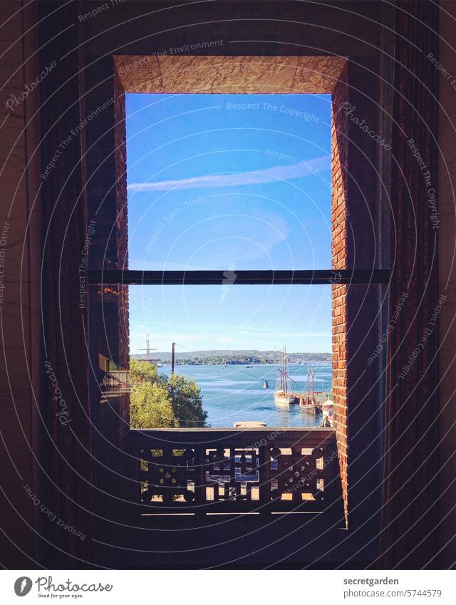 beautiful views Oslo Norway Vantage point Looking Window Sky Blue Brick Building Dark Bright Water Ocean Lake parapet Architecture Exterior shot Colour photo