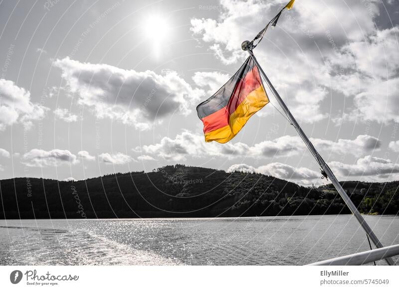 Colorful German flag against a black and white background Flag Germany German Flag Ensign Wind Blow Nationalities and ethnicity black-red-gold Flagpole Gold