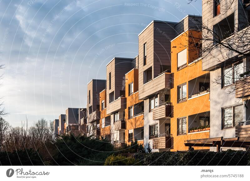 settlement Apartment house Balcony Clouds Sky Town Architecture Facade Housefront block of houses block of flats House (Residential Structure) Building dwell