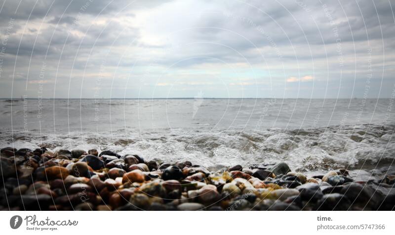 Surf on a rocky coast in front of the horizon under a cloudy sky Baltic Sea Ocean Beach Water stones Horizon Sky Clouds Weather Landscape Nature Environment