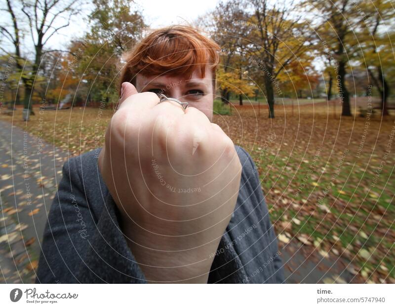 you better be | mindful Fist Park Woman Red-haired portrait trees Hand focus Feminine Autumn Confrontation seriously Caution Warn Clue embassy Respect