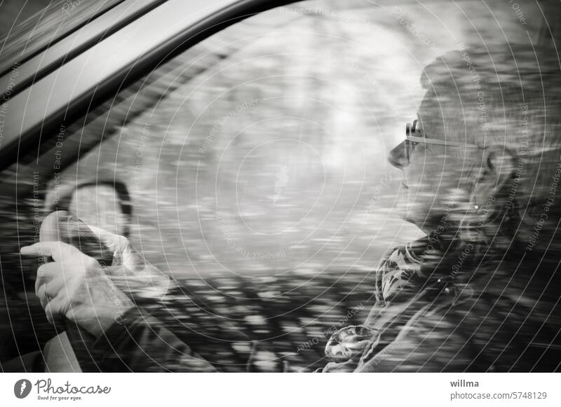 Mindfulness in traffic Motoring Car driver Senior citizen White-haired Concentrate attentiveness Human being Woman Eyeglasses Female senior B/W car go away