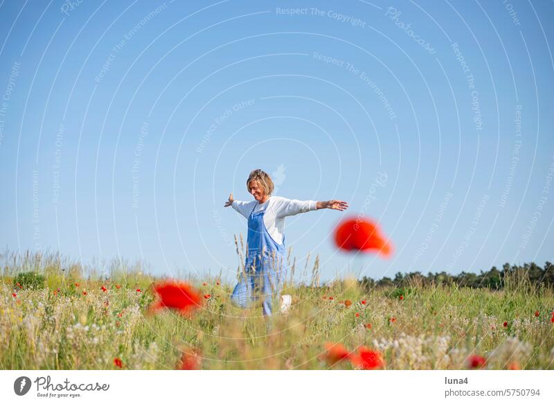 cheerful young woman in the poppy field Woman Laughter Young woman Brash high-spirited jubilate outstretched arms fortunate Poppy field emancipated pretty