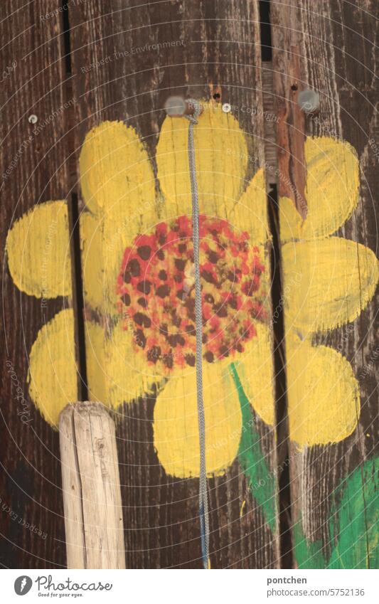 sunflower painted on a wooden hut. broomstick. cheerfulness Sunflower painting beautification Flower Yellow Broomstick Summer Wooden hut String Blossom