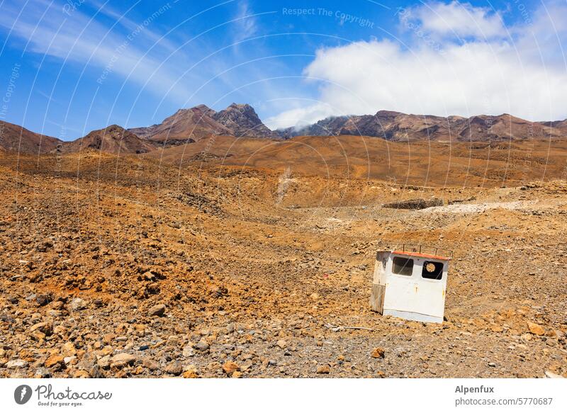 Wasteland with helmsman wasteland Desert Wheelhouse Bridge Rock Adventure Ship in the desert stones Volcano Landscape Exterior shot Colour photo