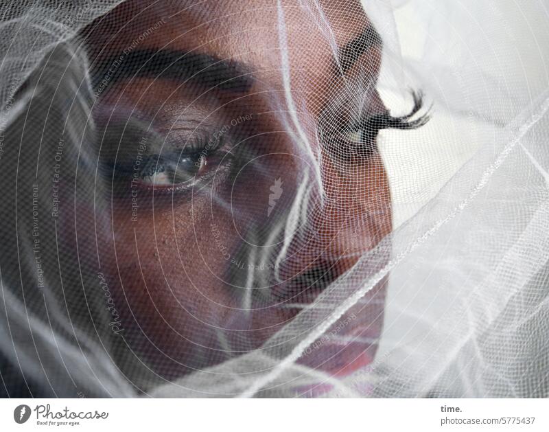 Woman with veil Vail Looking Meditative Cool-headed sad Perplexed doubting portrait Feminine