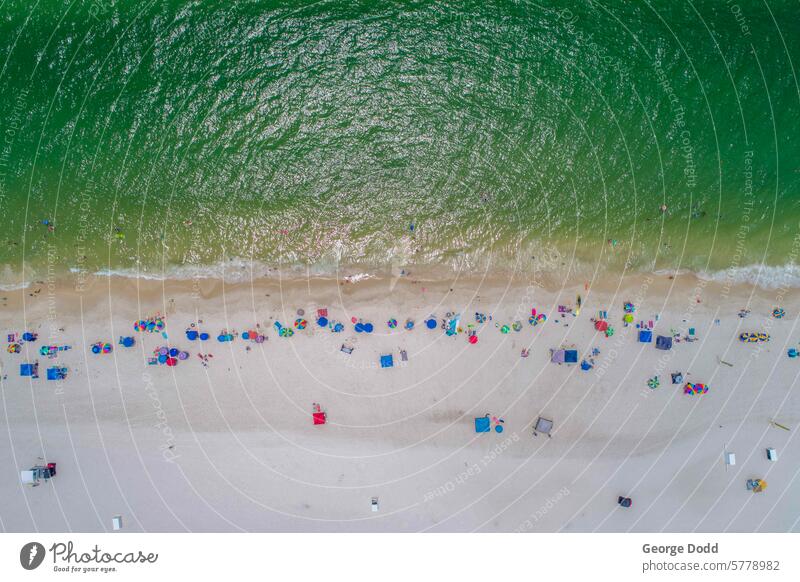 Gulf Shores Beach in July gulf Gulf of Mexico gulf coast Aerial photograph aerial view Drone drone view seaside seascape seashore shoreline Tide Waves Surf