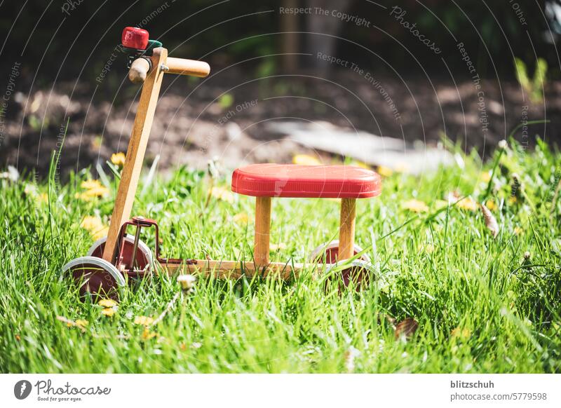 An old wheel in detail impeller Child Bicycle Infancy Toddler Playing Cycling Movement Leisure and hobbies Old Wheel Toys Close-up Detailed recording Mobility