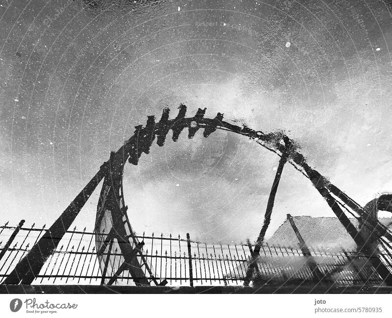 Reflection of a roller coaster Roller coaster Puddle reflection Reflection in the water rainy rainy weather Autumn Autumnal autumn atmosphere