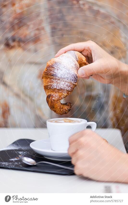 A cropped unrecognizable person enjoying a colombian Coffee and Homemade Croissant Breakfast breakfast coffee croissant homemade pastry powdered sugar cup