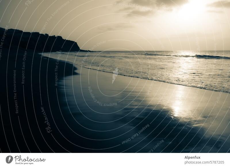 Atlantic beach in the evening at dusk Beach darkness Shadow Ocean Atlantic Ocean Water Sand Waves Rock Vacation & Travel Sky coast Nature Sunset Sunset sky