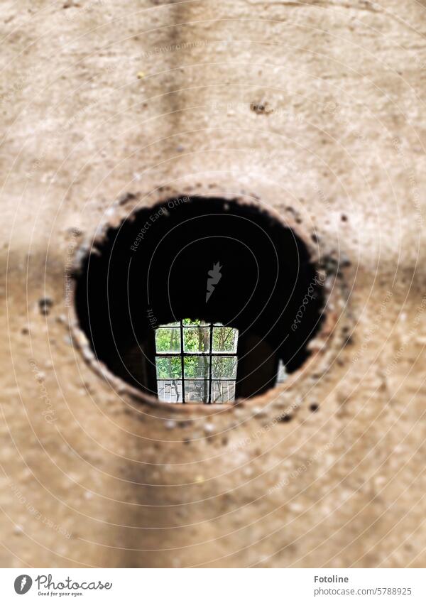 I can see the window one floor below me through a hole in the floor of a lost place. Hollow Ground Round Circle Circular Structures and shapes Black Brown