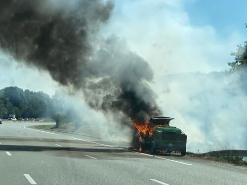 Burnt out - black cloud of smoke from a burning car on the side of the road burnout Accident Doom