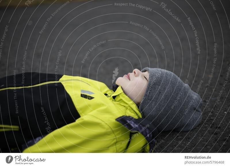 Child lying on the floor Boy (child) naturally Exterior shot To enjoy Human being Infancy Head portrait Authentic 3 - 8 years Lie Moody Emotions Exceptional