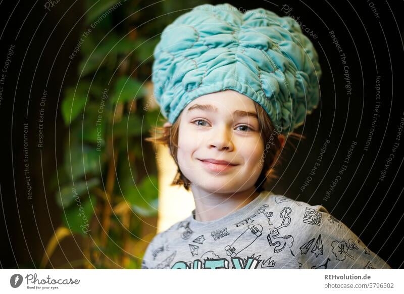 Boy with a brain cap Boy (child) Child Infancy Smiling contented Happy Joy Happiness Positive indoors Face Cheerful carefree Charming glad Cozy Flat (apartment)