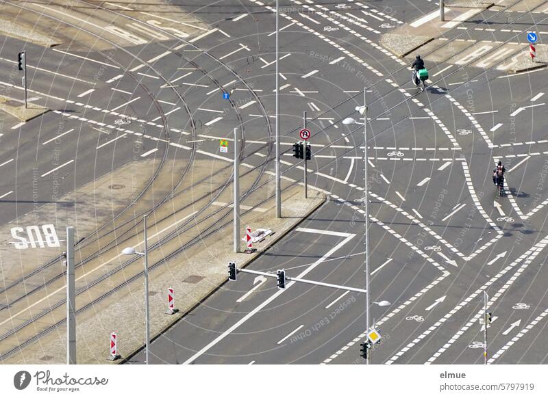 Large intersection from a bird's eye view with streetcar tracks, traffic lights, bus lane, cycle lanes, road markings, traffic signs Crossroads Bird's-eye view